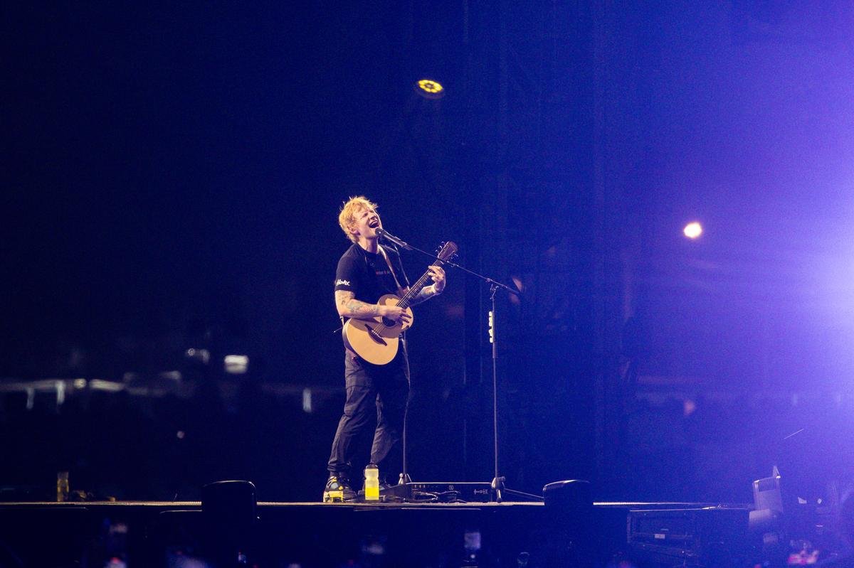 Ed Sheeran performing on stage in India