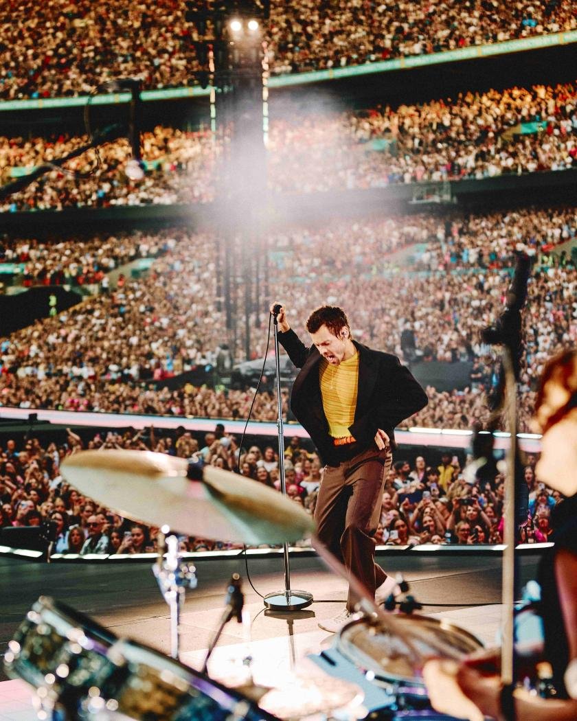 Harry Styles performing live before a concert audience