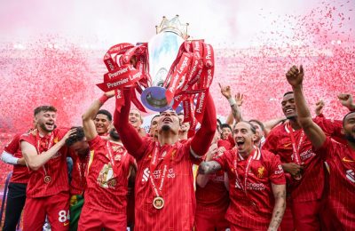 LIVERPOOL, ENGLAND - MAY 25: Virgil van Dijk of Liverpool lifts the trophy after the Premier League match between Liverpool FC and Crystal Palace FC at Anfield on May 25, 2025 in Liverpool, England. (Photo by Michael Regan/Getty Images/Getty Images For The Premier League)